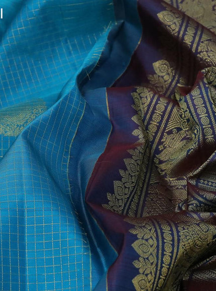 Pure kanjivaram silk saree cs blue and dual shade of maroon with allover zari checks & buttas and long zari woven border