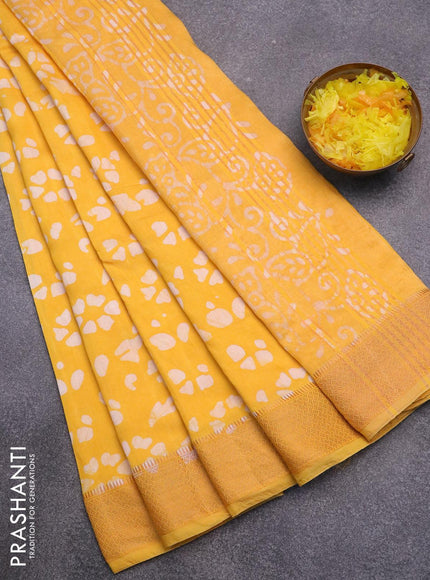 Semi gadwal saree yellow with allover batik prints and zari woven border