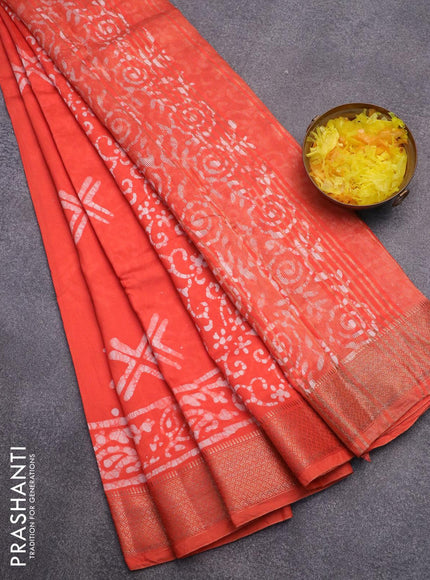 Semi gadwal saree orange with allover batik prints and zari woven border