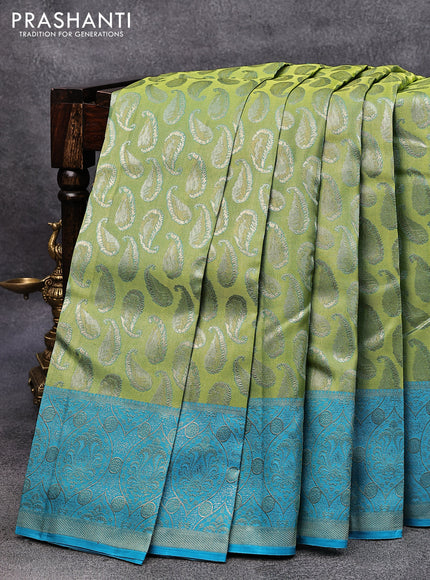 Pure kanjivaram tissue silk saree dual shade of light green and blue with allover zari woven paisley butta weaves and rich zari woven border