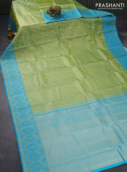 Pure kanjivaram tissue silk saree dual shade of light green and blue with allover zari woven paisley butta weaves and rich zari woven border