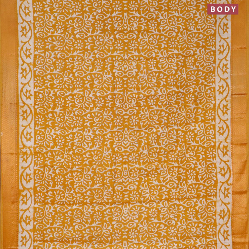 Semi gadwal saree mustard shade with allover butta prints and zari woven border