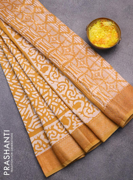 Semi gadwal saree dark mustard and off white with allover batik prints and zari woven border