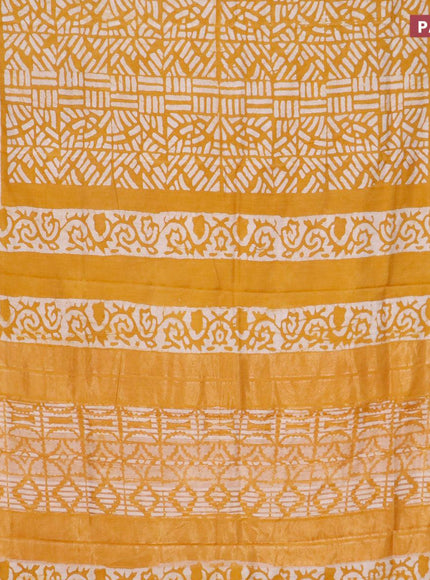 Semi gadwal saree dark mustard and off white with allover batik prints and zari woven border