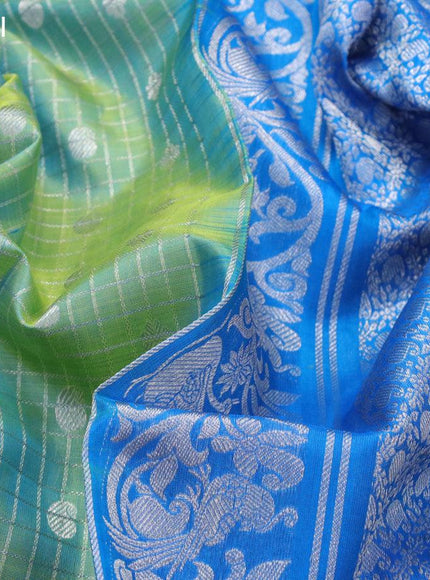 Venkatagiri silk saree dual shade of teal bluish green and cs blue with allover silver checks & butta weaves and long rich silver zari woven border