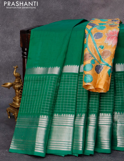 Mangalgiri silk cotton saree green and mustard yellow with plain body and long silver zari woven checks border & kalamkari hand painted blouse