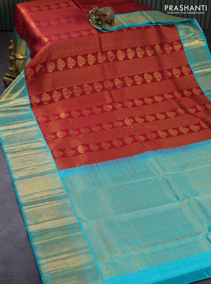 Pure kanjivaram silk saree maroom and teal blue with allover zari weaves & buttas and long zari woven floral border