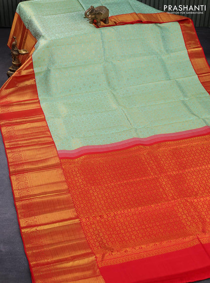 Pure kanjivaram silk saree teal shade and red with allover zari woven floral brocade weaves and long zari woven floral border