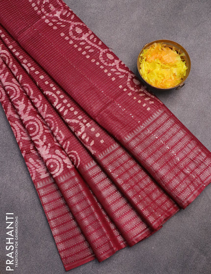 Semi tussar saree dark maroon with allover batik prints and long zari woven border