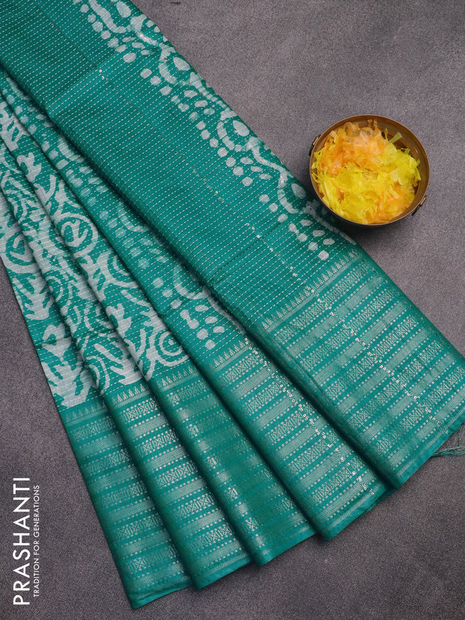 Semi tussar saree teal green with allover batik prints and long silver zari woven border