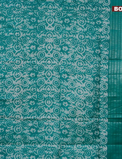 Semi tussar saree teal green with allover batik prints and long silver zari woven border