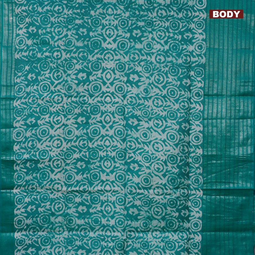 Semi tussar saree teal green with allover batik prints and long silver zari woven border