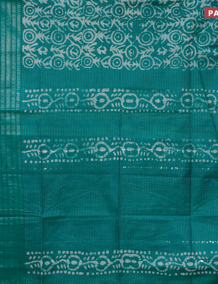 Semi tussar saree teal green with allover batik prints and long silver zari woven border