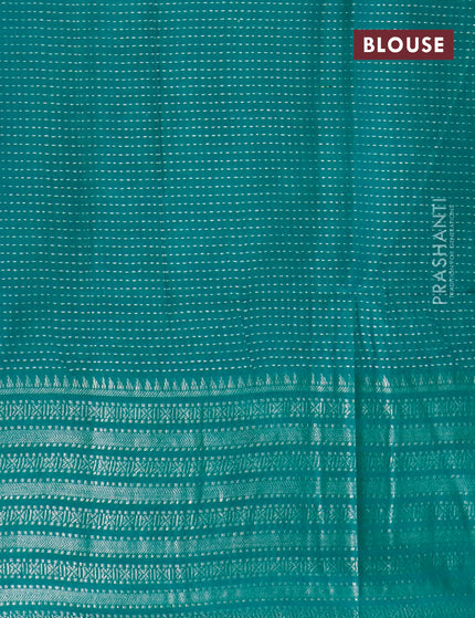 Semi tussar saree teal green with allover batik prints and long silver zari woven border