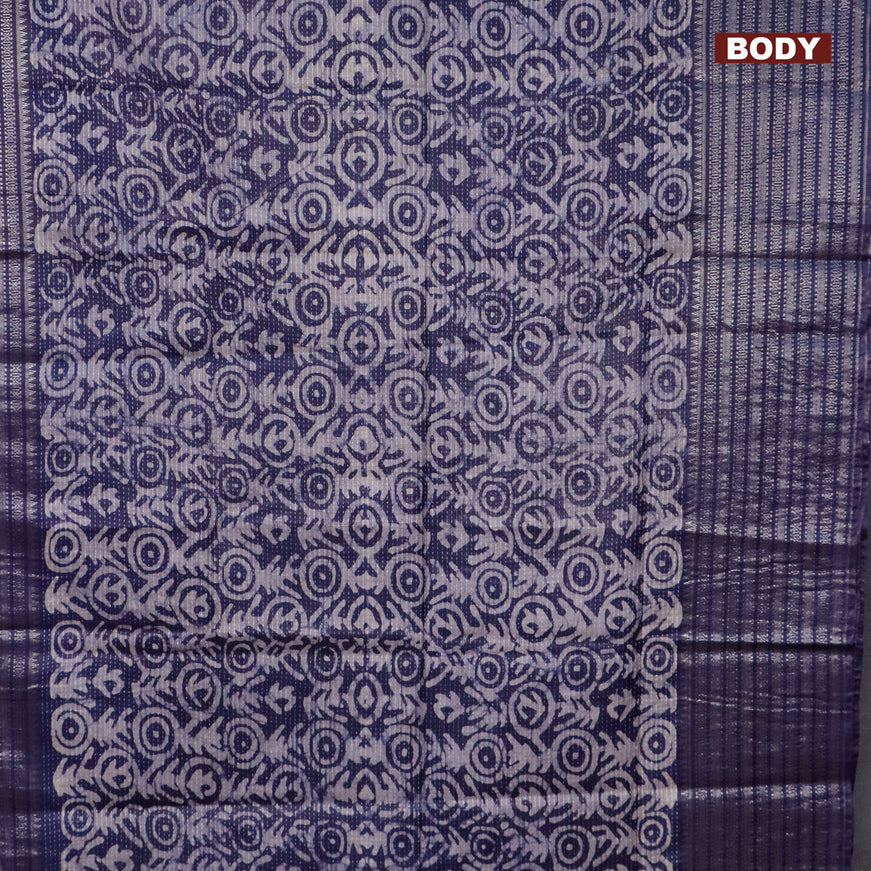 Semi tussar saree navy blue with allover batik prints and long silver zari woven border