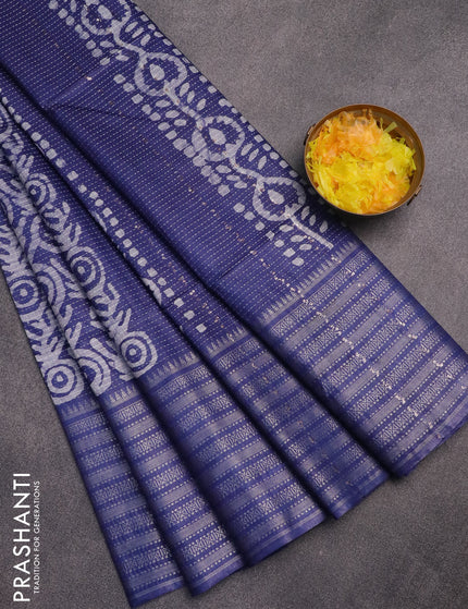 Semi tussar saree blue with allover batik prints and long silver zari woven border