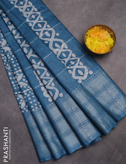 Semi tussar saree cs blue with allover batik prints and long silver zari woven border