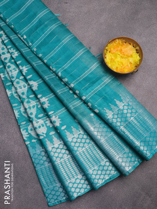 Semi tussar saree teal green and off white with allover batik prints and long temple design silver zari woven border