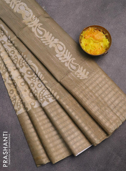 Semi tussar saree elaichi green and beige with allover batik prints and long zari woven border