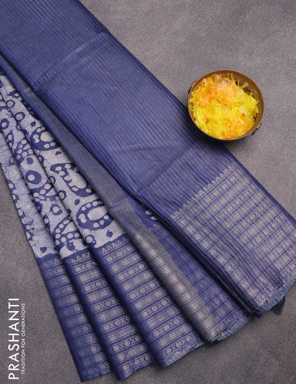 Semi tussar saree blue and off white with allover batik prints and long zari woven border