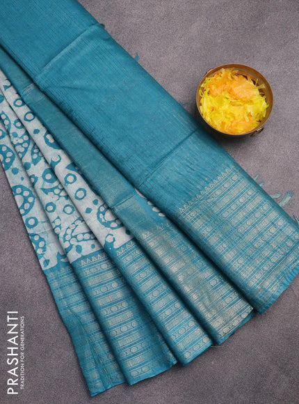 Semi tussar saree teal blue and beige with allover batik prints and long zari woven border