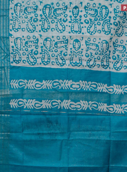 Semi tussar saree teal blue and beige with allover batik prints and long zari woven border