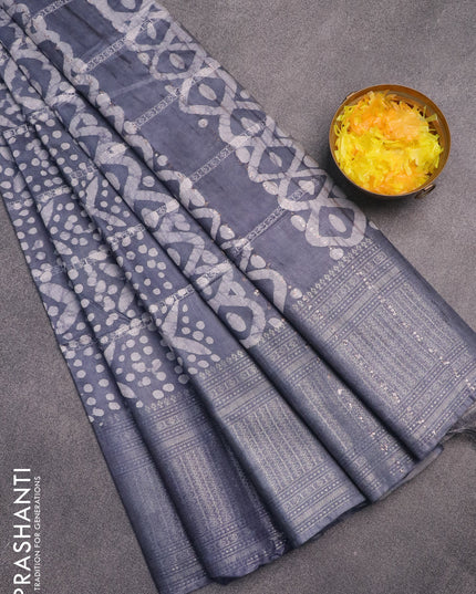 Semi tussar saree grey with allover batik prints and long zari woven border