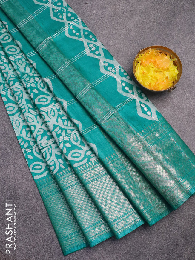 Semi tussar saree teal green and off white with allover batik prints and long zari woven border