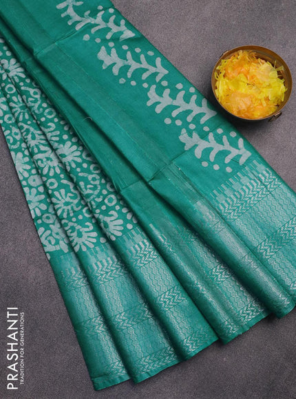 Semi tussar saree teal green with allover batik prints and long temple design silver zari woven border