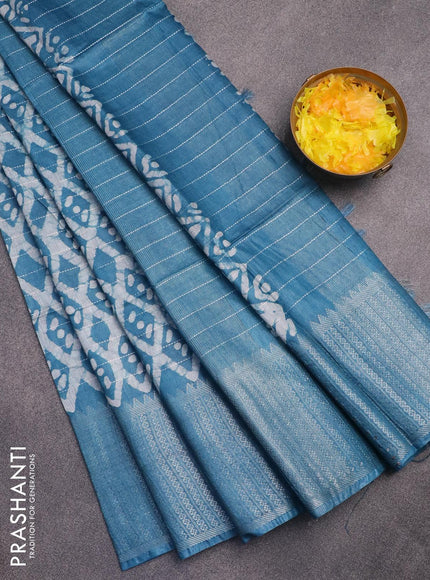 Semi tussar saree cs blue with allover batik prints & thread stripe weaves and long silver zari woven border