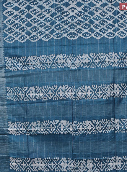 Semi tussar saree cs blue with allover batik prints & thread stripe weaves and long silver zari woven border