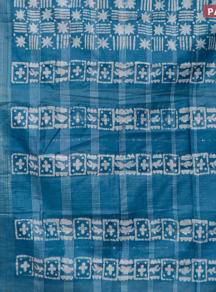 Semi tussar saree peacock blue and off white with allover batik prints and long silver zari woven border