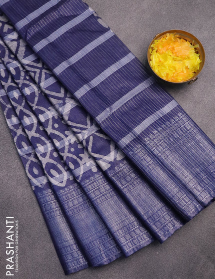 Semi tussar saree navy blue with allover batik prints and long silver zari woven border