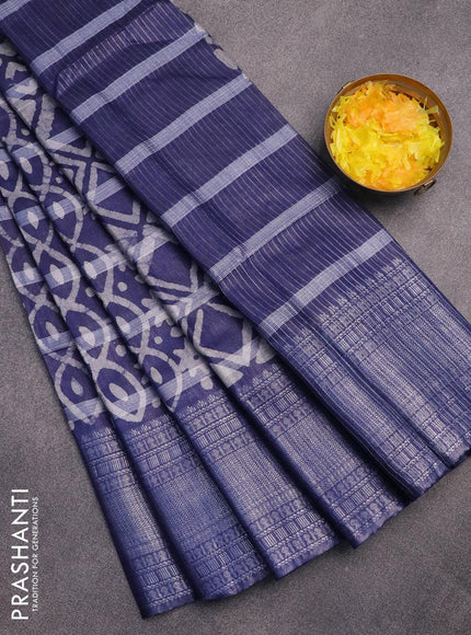 Semi tussar saree navy blue with allover batik prints and long silver zari woven border