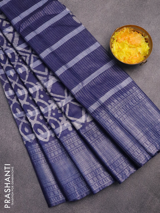 Semi tussar saree navy blue with allover batik prints and long silver zari woven border