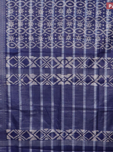 Semi tussar saree navy blue with allover batik prints and long silver zari woven border