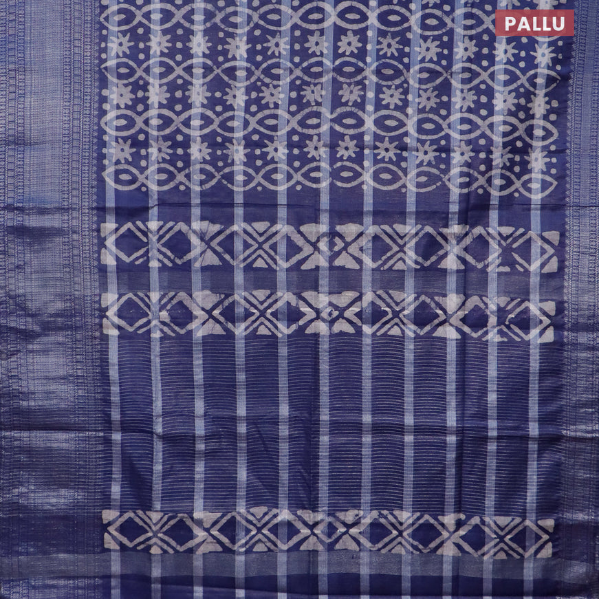 Semi tussar saree navy blue with allover batik prints and long silver zari woven border