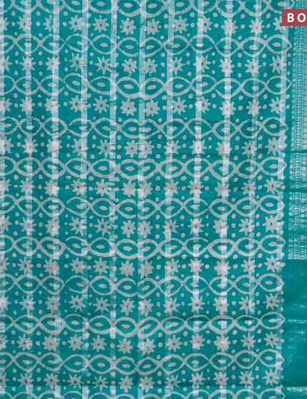 Semi tussar saree teal green with allover batik prints and long silver zari woven border