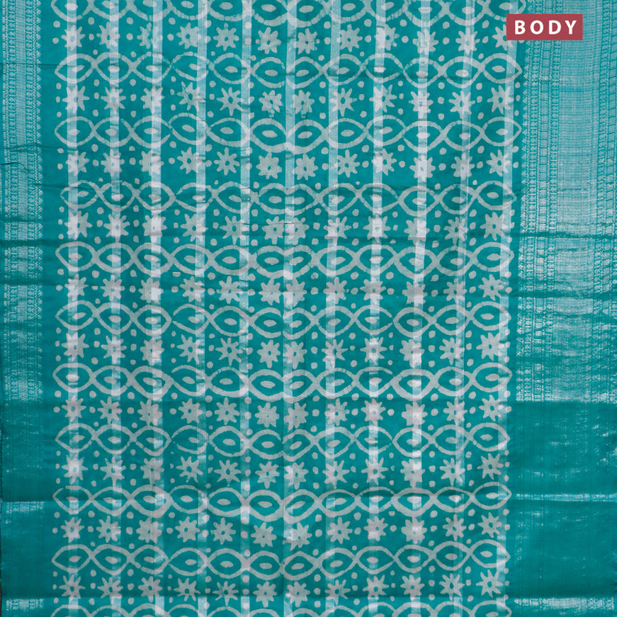 Semi tussar saree teal green with allover batik prints and long silver zari woven border