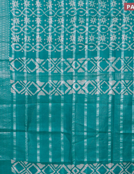 Semi tussar saree teal green with allover batik prints and long silver zari woven border