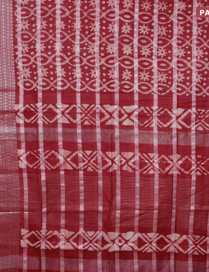 Semi tussar saree maroon with allover batik prints and long silver zari woven border