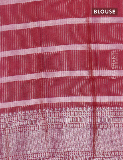 Semi tussar saree maroon with allover batik prints and long silver zari woven border