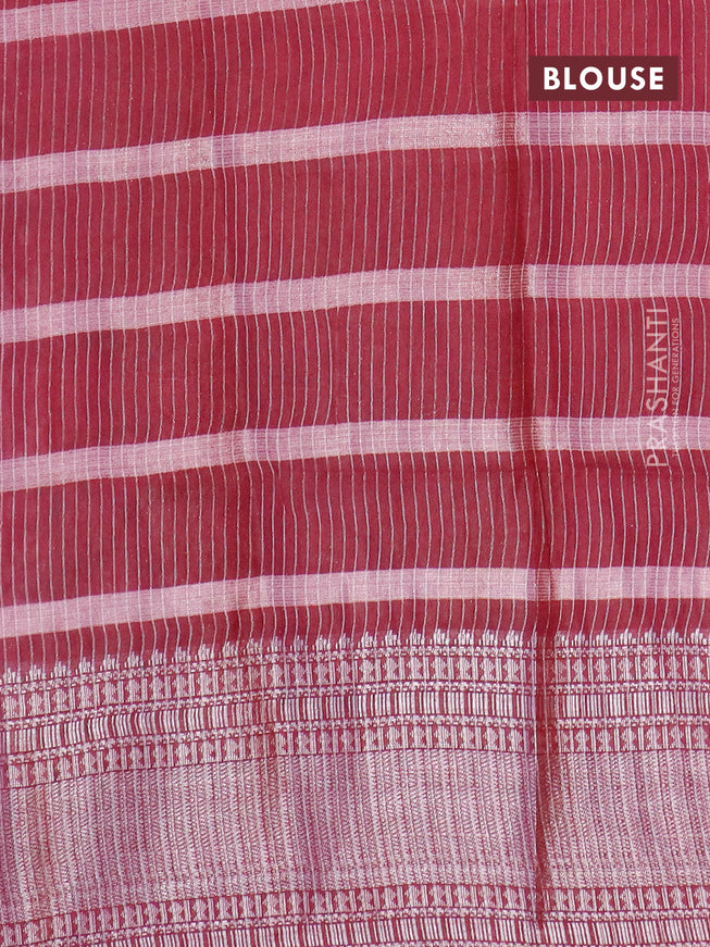 Semi tussar saree maroon with allover batik prints and long silver zari woven border