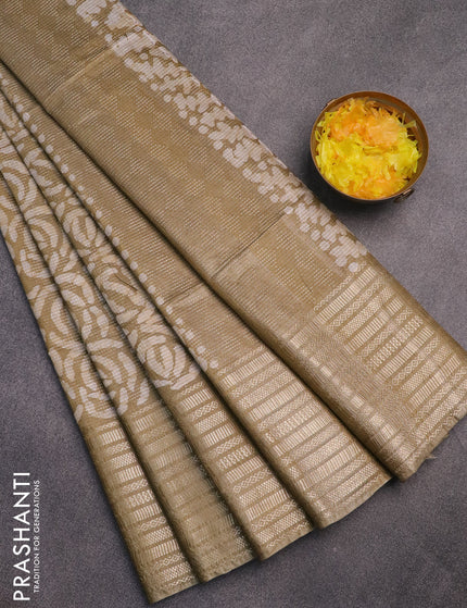 Semi tussar saree elaichi green and beige with allover batik prints and long silver zari woven border