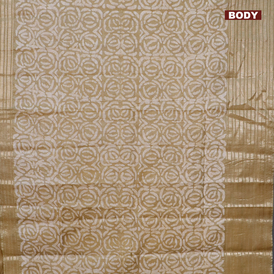 Semi tussar saree elaichi green and beige with allover batik prints and long silver zari woven border