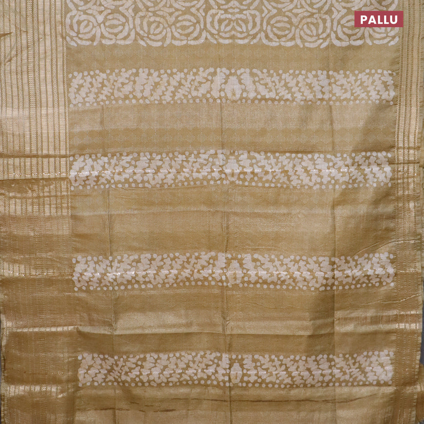 Semi tussar saree elaichi green and beige with allover batik prints and long silver zari woven border