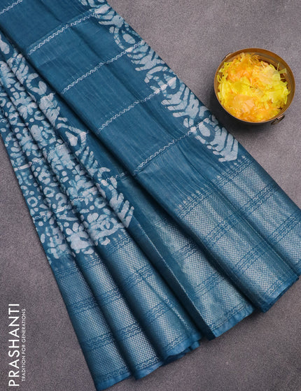 Semi tussar saree peacock blue with allover batik prints and long silver zari woven border