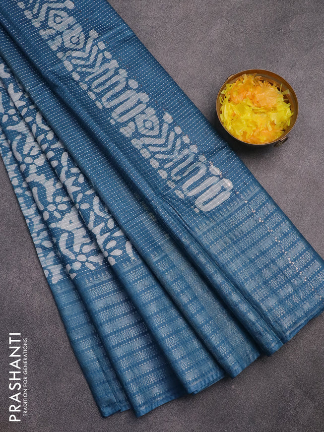 Semi tussar saree peacock blue and off white with allover batik prints and long silver zari woven border