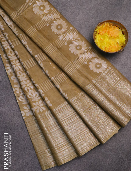 Semi tussar saree mehendi green with allover batik prints and long silver zari woven border