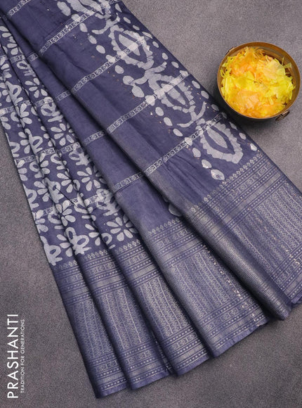 Semi tussar saree dark grey with allover batik prints and long silver zari woven border